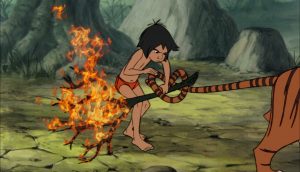 mowgli_is_tieing_a_fire_branch_to_shere_khan_the_tigers_tail